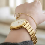 What to Wear to Attract Rich Men: Luxury Look on a Budget (That Actually Works) close-up of elegant jewelry details, delicate gold hoops, simple necklace, luxury watch on wrist, re
