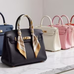 Designer Bags Worth Investing In: Brands Rich Men Actually Notice (And Why It Matters) Elegant luxury designer handbag collection displayed on marble surface with soft natural lighting, H