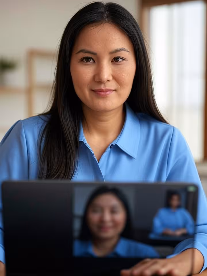 Professional video call setup on laptop showing split screen of attractive woman in tasteful outfit